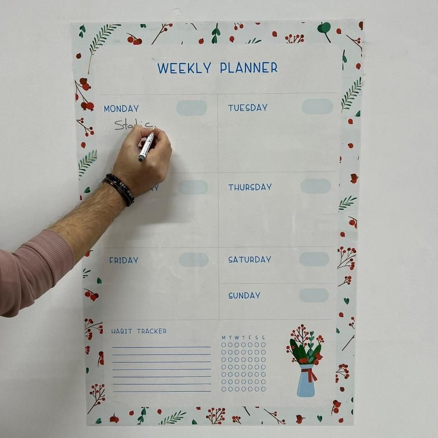 "Minimalist white weekly planner organizer sheet with clean columns for each day, designed for adult use. The sheet is lightweight and flat-laying, made from plastic and paper with a sturdy cardboard cover. Ideal for productivity, scheduling, and weekly task management."