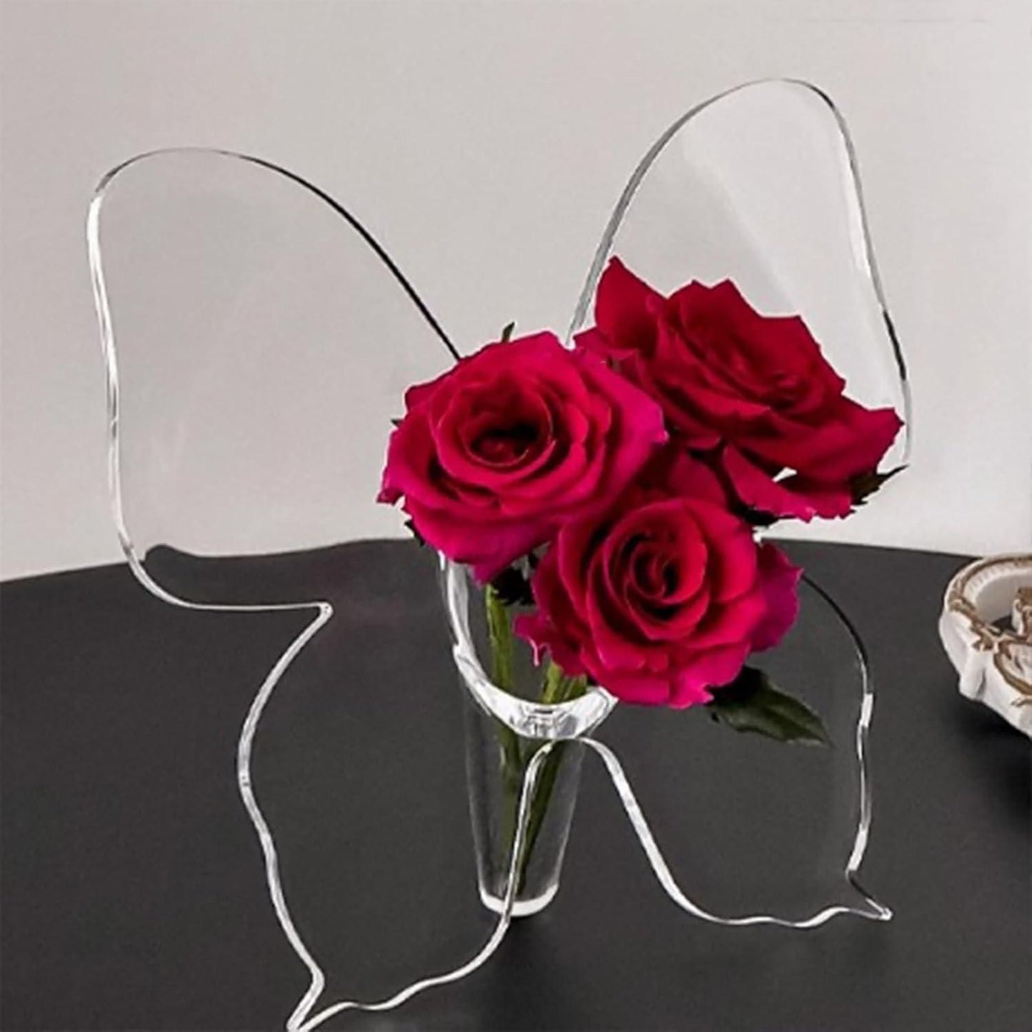 Clear butterfly frame vase made of transparent material, perfect as an art flower holder and modern home décor piece