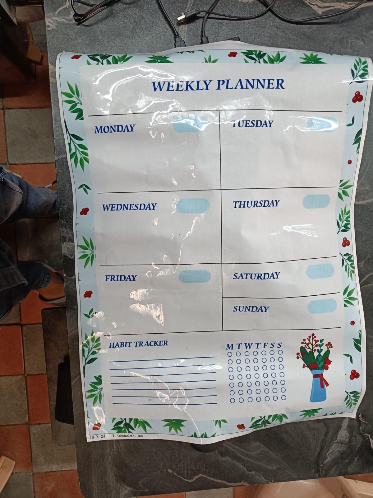 "Minimalist white weekly planner organizer sheet with clean columns for each day, designed for adult use. The sheet is lightweight and flat-laying, made from plastic and paper with a sturdy cardboard cover. Ideal for productivity, scheduling, and weekly task management."